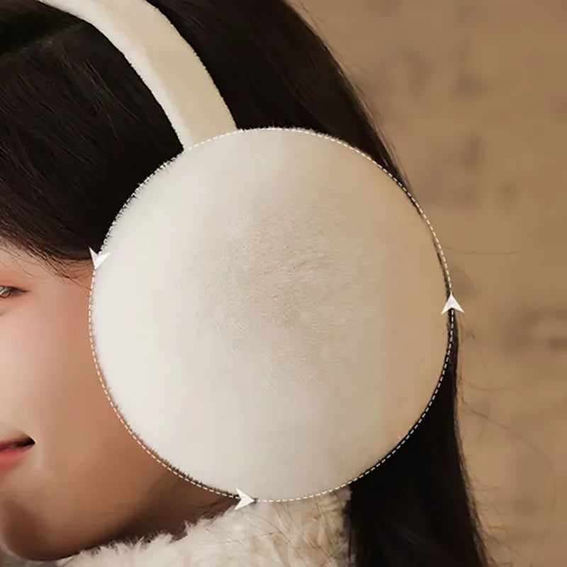Fluffy plush earmuffs being worn, White