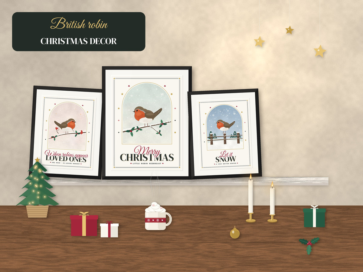 Framed robin Christmas prints styled on a festive shelf